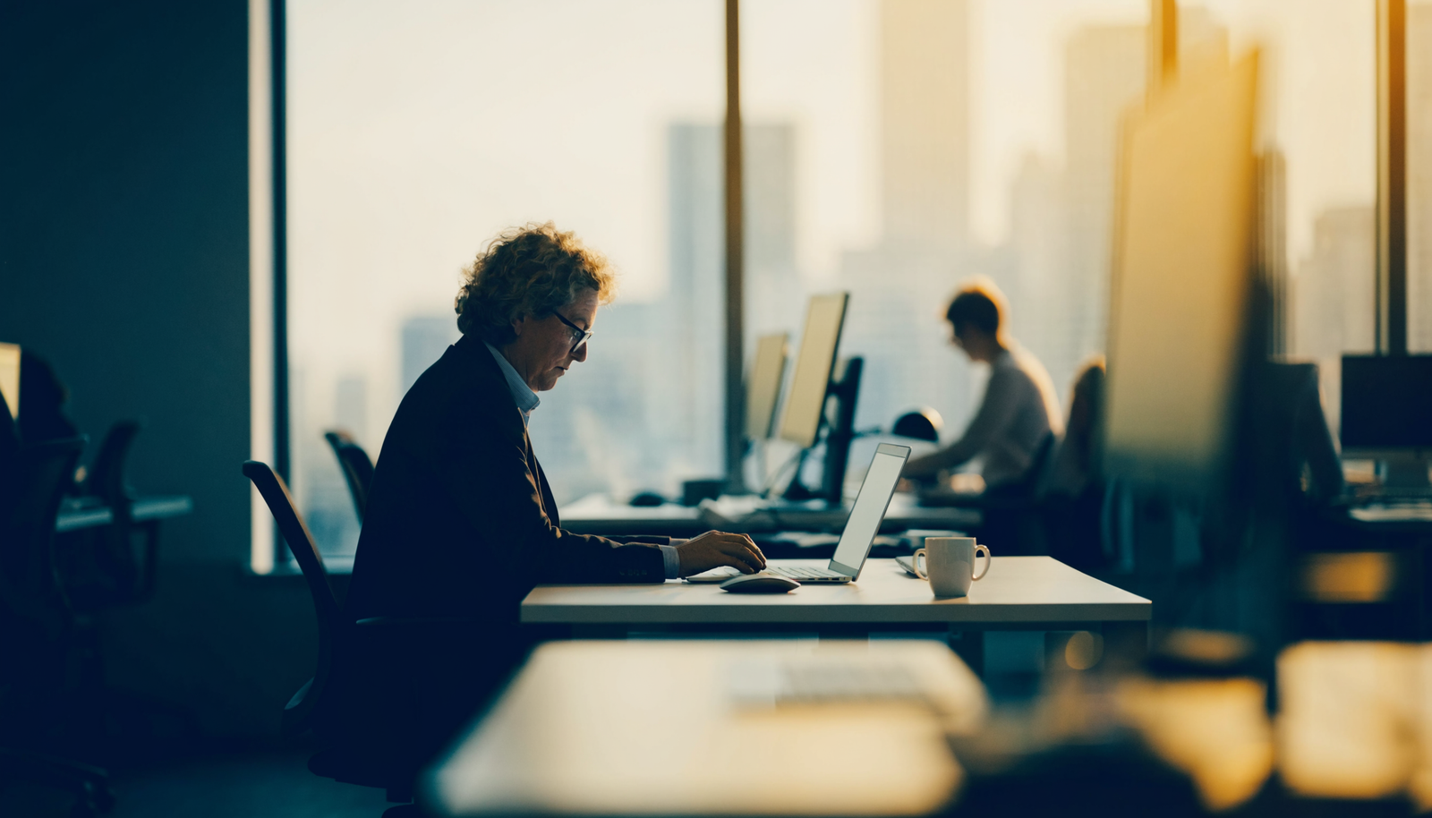 A skilled professional working in a modern open-plan Melbourne office